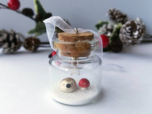 Load image into Gallery viewer, Miniature hedgehog and red toadstool Christmas decoration. Little pottery hedgehog in a glass bottle. Christmas woodland mini ornament