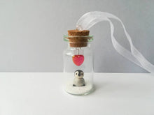 Load image into Gallery viewer, Miniature penguin chick gift. Little pottery penguin in a glass bottle. Red love heart mini penguin ornament