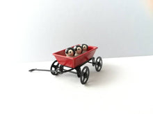 Load image into Gallery viewer, Miniature penguins in a cart. Little pottery penguin chicks in a red truck. Cute penguins
