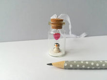 Load image into Gallery viewer, Miniature penguin gift. Little pottery penguin in a glass bottle. Red love heart mini penguin ornament