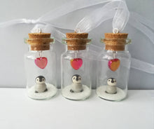 Load image into Gallery viewer, Miniature penguin chick gift. Little pottery penguin in a glass bottle. Red love heart mini penguin ornament