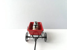 Load image into Gallery viewer, Miniature penguins in a cart. Little pottery penguin chicks in a red truck. Cute penguins