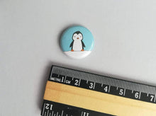 Load image into Gallery viewer, Cute little penguin badge, with a ruler to show the size