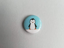 Load image into Gallery viewer, Penguin in the snow blue button badge
