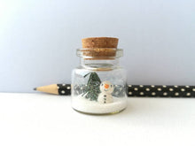 Load image into Gallery viewer, Miniature snowman Christmas decoration. Little pottery snowman and tree in a glass bottle. Christmas mini ornament
