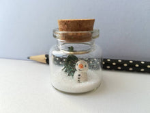 Load image into Gallery viewer, Miniature snowman Christmas decoration. Little pottery snowman and tree in a glass bottle. Christmas mini ornament