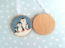Load image into Gallery viewer, Penguin family decoration. Wooden Christmas ornament, penguins in the snow, eco friendly wood