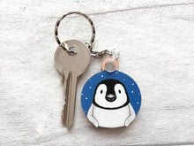 Load image into Gallery viewer, Penguin chick keyring. Wooden key fob, blue starry night, penguin key chain, wood bag charm, responsibly resourced wood