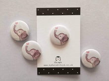 Load image into Gallery viewer, Mini round white button badge, it has an illustration of a grey elephant with a pink heart above it&#39;s trunk
