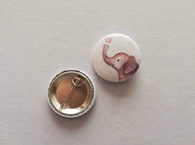 Load image into Gallery viewer, Back and front of a mini round white button badge, it has an illustration of a grey elephant with a pink heart above it&#39;s trunk
