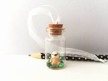 Load image into Gallery viewer, Miniature sloth ornament. Little pottery sloth decoration in a glass bottle. Christmas mini sloth ornament