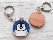 Load image into Gallery viewer, Penguin chick keyring. Wooden key fob, blue starry night, penguin key chain, wood bag charm, responsibly resourced wood