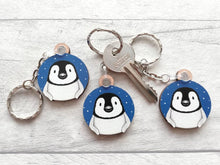 Load image into Gallery viewer, Penguin chick keyring. Wooden key fob, blue starry night, penguin key chain, wood bag charm, responsibly resourced wood