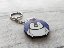 Load image into Gallery viewer, Penguin chick keyring. Wooden key fob, blue starry night, penguin key chain, wood bag charm, responsibly resourced wood