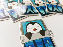 Load image into Gallery viewer, Penguin vinyl sticker, sleeping penguin sticker, sardine tin bed sticker