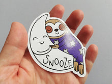 Load image into Gallery viewer, Sloth vinyl sticker, sleeping sloth sticker, snooze on a moon sticker, purple or blue

