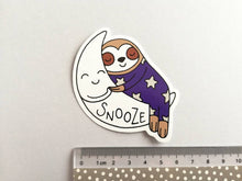 Load image into Gallery viewer, Sloth vinyl sticker, sleeping sloth sticker, snooze on a moon sticker, purple or blue
