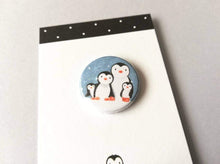 Load image into Gallery viewer, Penguin button badge, snow scene, with family of penguins cuddling, great Christmas gift
