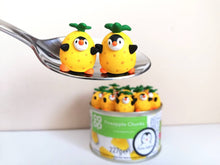 Load image into Gallery viewer, Penguin pineapple. Little penguin in a box, black and white miniature pottery penguin in a yellow pineapple, ceramic quirky penguin gift