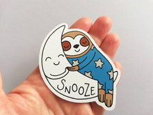 Load image into Gallery viewer, Sloth vinyl sticker, sleeping sloth sticker, snooze on a moon sticker, purple or blue