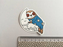 Load image into Gallery viewer, Sloth vinyl sticker, sleeping sloth sticker, snooze on a moon sticker, purple or blue