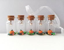 Load image into Gallery viewer, Miniature pumpkin decoration. Little pottery pumpkin in a glass bottle. Halloween mini star autumn ornament