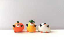 Load image into Gallery viewer, Penguin pineapple. Little penguin in a box, black and white miniature pottery penguin in a yellow pineapple, ceramic quirky penguin gift
