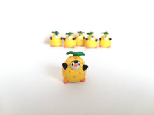 Load image into Gallery viewer, Penguin pineapple. Little penguin in a box, black and white miniature pottery penguin in a yellow pineapple, ceramic quirky penguin gift