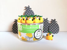 Load image into Gallery viewer, Penguin pineapple. Little penguin in a box, black and white miniature pottery penguin in a yellow pineapple, ceramic quirky penguin gift
