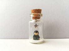 Load image into Gallery viewer, Miniature mole decoration. Little pottery hedgehog in a glass bottle. Christmas mole, snow and star ornament