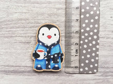 Load image into Gallery viewer, Little wooden penguin magnet, in a blue dressing gown and slippers
