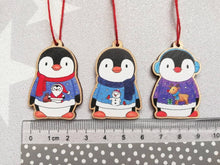 Load image into Gallery viewer, Penguin Christmas decorations. Set of three wooden penguins. Christmas jumper, deer, snowman, santa. Cute Christmas tree ornaments.