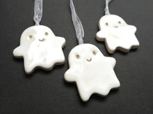 Load image into Gallery viewer, Pottery ghost hanger. Little happy ghost tag. Hand painted ceramics, Halloween ornament