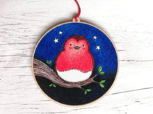 Load image into Gallery viewer, Wooden robin Christmas ornament, robin sat on a branch with stars in the sky
