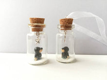Load image into Gallery viewer, Miniature mole decoration. Little pottery hedgehog in a glass bottle. Christmas mole, snow and star ornament
