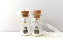 Load image into Gallery viewer, Miniature mole decoration. Little pottery hedgehog in a glass bottle. Christmas mole, snow and star ornament