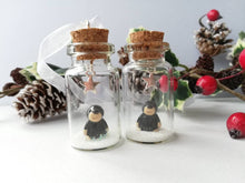 Load image into Gallery viewer, Miniature mole decoration. Little pottery hedgehog in a glass bottle. Christmas mole, snow and star ornament
