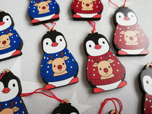 Load image into Gallery viewer, Penguin reindeer jumper decoration. Little wooden penguin wearing a blue or red jumper Christmas ornament, responsibly resourced wood
