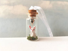 Load image into Gallery viewer, Miniature rabbit decoration. Little pottery white rabbit in a glass bottle. Mini bunny ornament and silver heart. Easter tree
