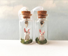 Load image into Gallery viewer, Miniature rabbit decoration. Little pottery white rabbit in a glass bottle. Mini bunny ornament and silver heart. Easter tree
