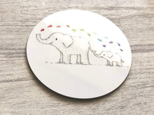 Load image into Gallery viewer, Elephant round coaster. Two elephants on a white background squirting rainbow colour drops of water from their trunk
