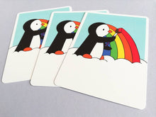 Load image into Gallery viewer, Rainbow penguin postcard. Penguin painting a rainbow, postcard for posting or framing
