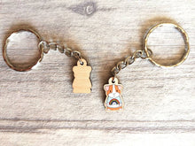 Load image into Gallery viewer, Little guinea pig keyring, cute mini piggy, rainbow jumper wooden key chain, ethically sourced wood, eco friendly charm