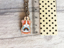 Load image into Gallery viewer, Little guinea pig keyring, cute mini piggy, rainbow jumper wooden key chain, ethically sourced wood, eco friendly charm