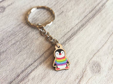 Load image into Gallery viewer, Little penguin keyring, cute rainbow mini tag, wooden key chain, penguin wearing a jumper, ethically sourced wood, eco friendly charm