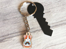 Load image into Gallery viewer, Little guinea pig keyring, cute mini piggy, rainbow jumper wooden key chain, ethically sourced wood, eco friendly charm