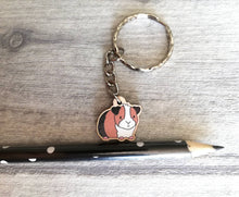 Load image into Gallery viewer, Mini guinea pig keyring, small cavy wooden key fob, ethically sourced wood, tri colour guinea pig key chain, bag charm