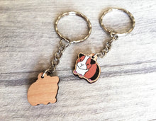 Load image into Gallery viewer, Mini guinea pig keyring, small cavy wooden key fob, ethically sourced wood, tri colour guinea pig key chain, bag charm