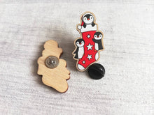 Load image into Gallery viewer, Christmas stocking pin, penguin wooden pin brooch, Responsibly resourced wood, eco friendly. Christmas penguins stocking filler