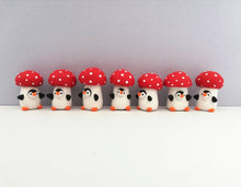 Load image into Gallery viewer, Toadstool penguin. Little penguin in a box, autumn miniature pottery penguin in a red and white mushroom, ceramic quirky Halloween gift